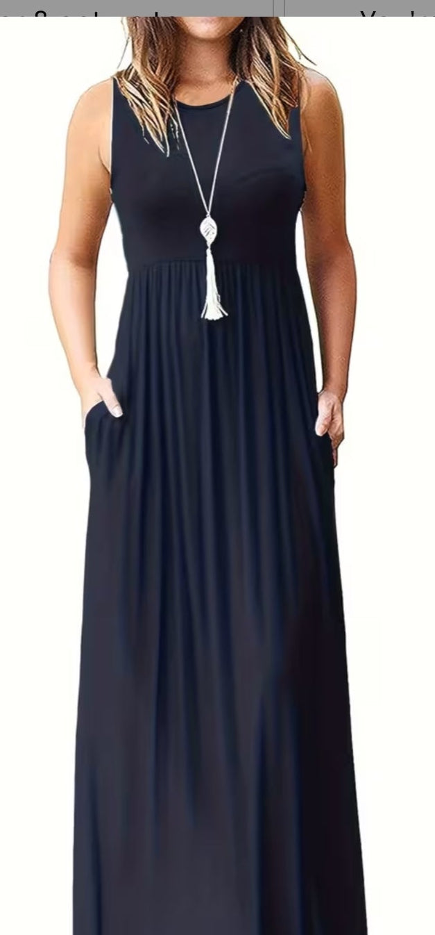 A sleeveless, floor-length navy blue maxi dress with side pockets.
